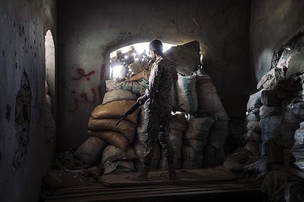 TAIZ, YEMEN - NOVEMBER 26th, 2018:A militiaman stands in a frontline position in the area called al-Zunuj on the northern front of Taiz.The frontline that encircle the city has not moved significantly in the past two years. Humanitarian aid and supplies can be delivered into the city only through a single road still under the control of the coalition.Photo by Lorenzo Tugnoli/ The Washington Post/ Contrasto